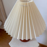 Close-up of crisp cream pleats on Cylvara conical lampshade
