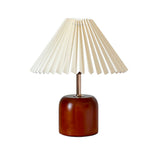 Cylvara compact wood table lamp with cream pleated conical shade