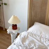 Cylvara cream-shade bedside lamp beside white bedding