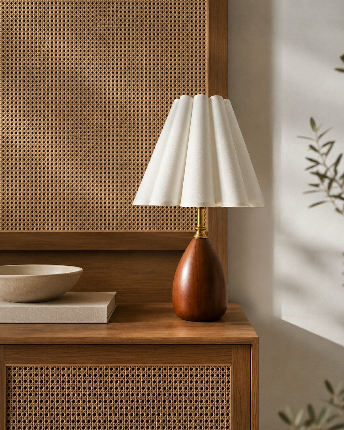 Walnut-tone table lamp styled beside woven cane