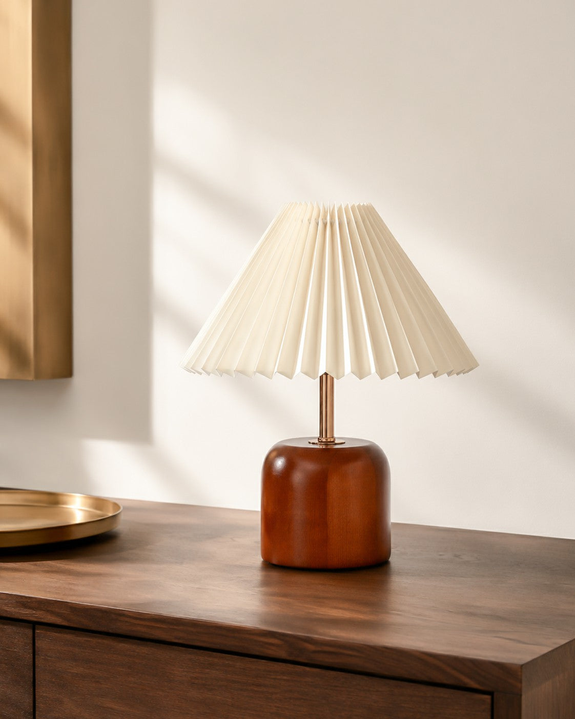 Walnut-tone table lamp styled with restrained warm metal accents
