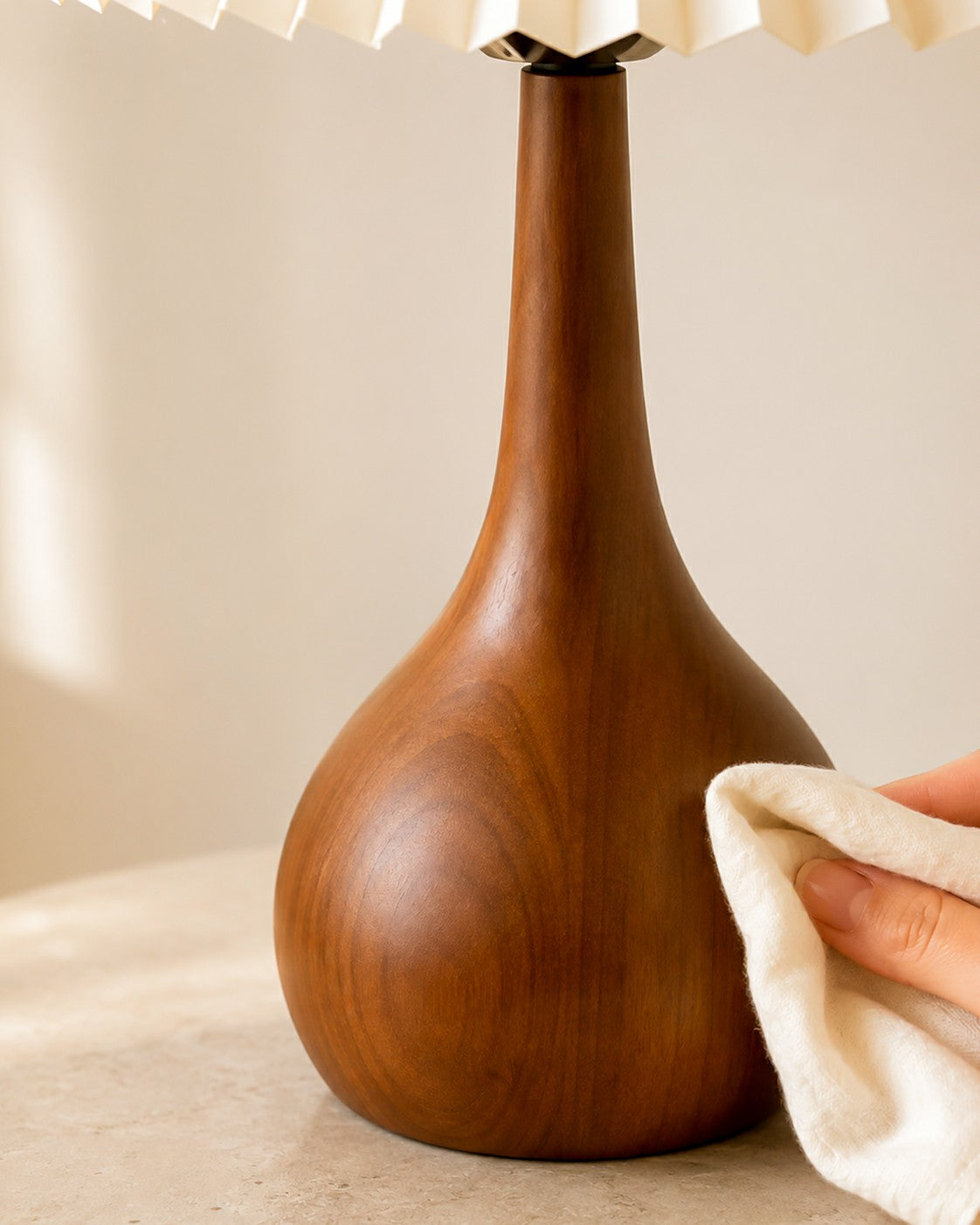 Close view of a walnut-tone lamp base surface