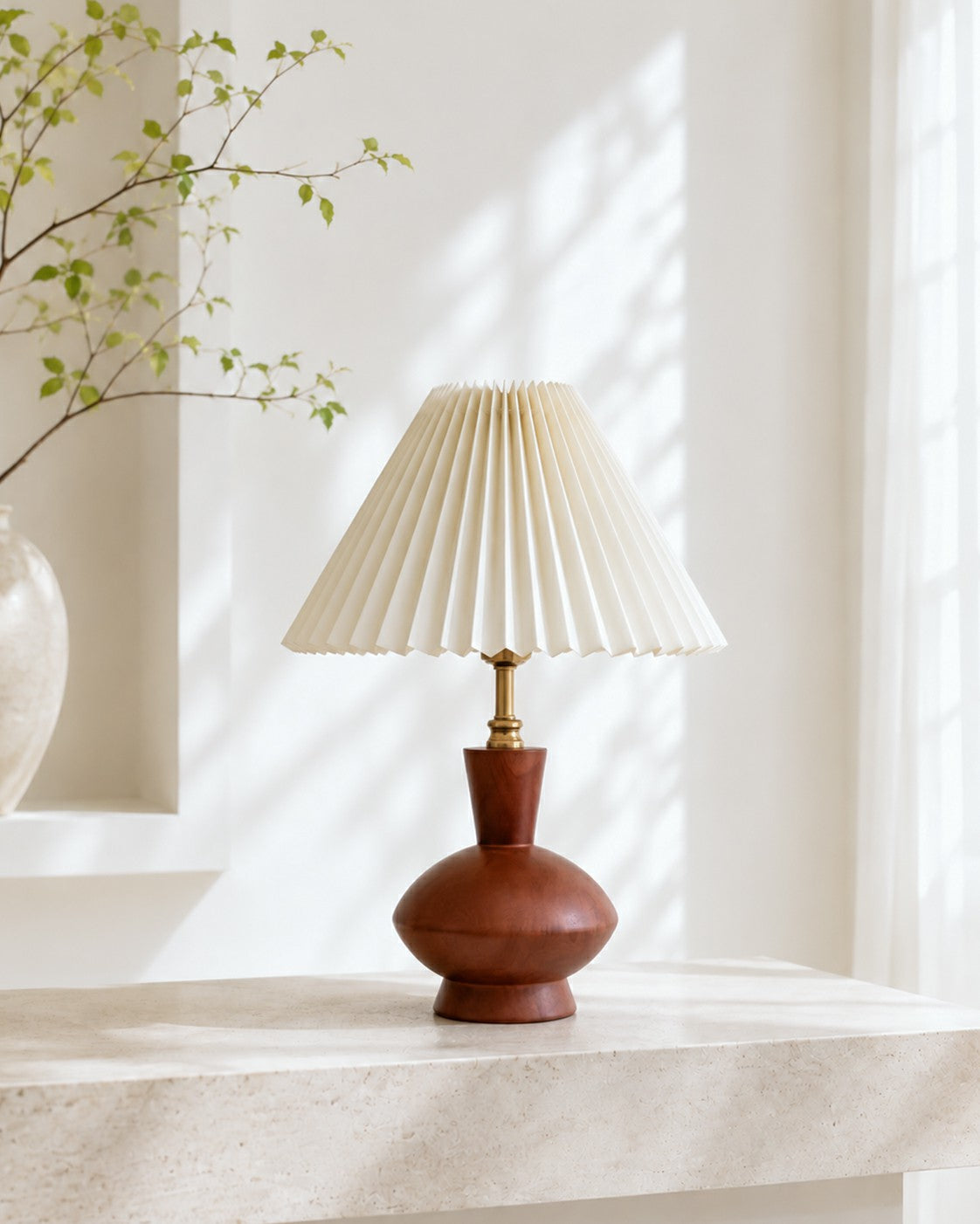 Walnut-tone table lamp styled on a pale stone surface