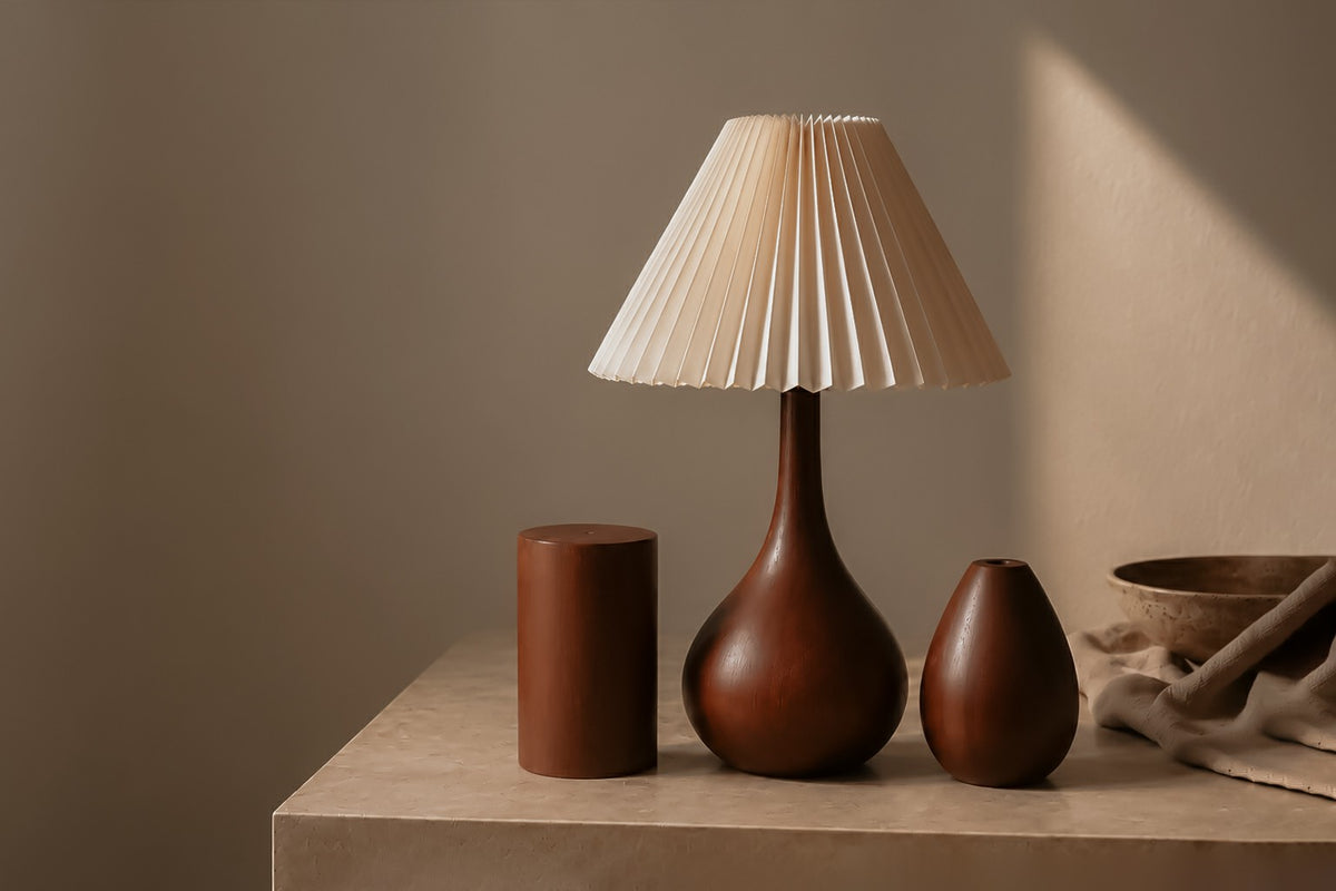 Walnut-tone table lamp with a cream pleated shade